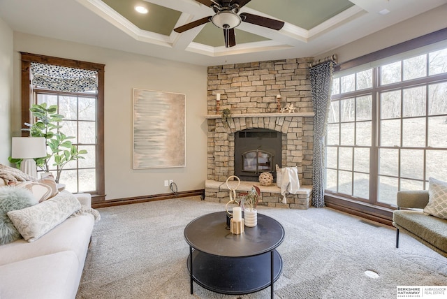 carpeted living room featuring visible vents, baseboards, coffered ceiling, ceiling fan, and crown molding