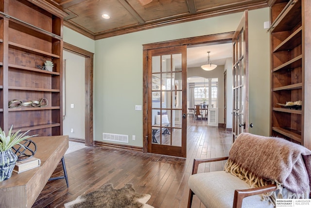 home office featuring visible vents, ornamental molding, french doors, hardwood / wood-style flooring, and coffered ceiling