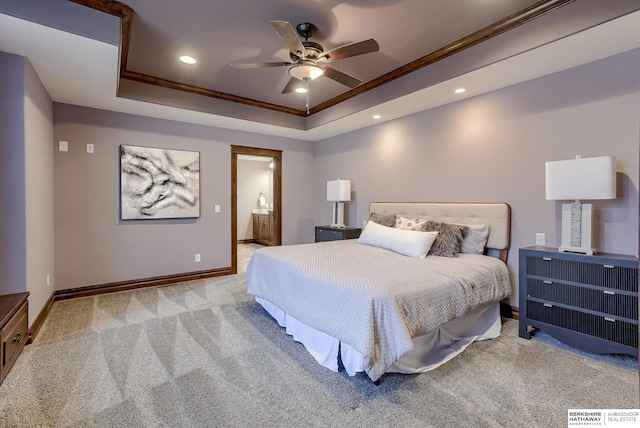 carpeted bedroom with recessed lighting, baseboards, crown molding, and a tray ceiling