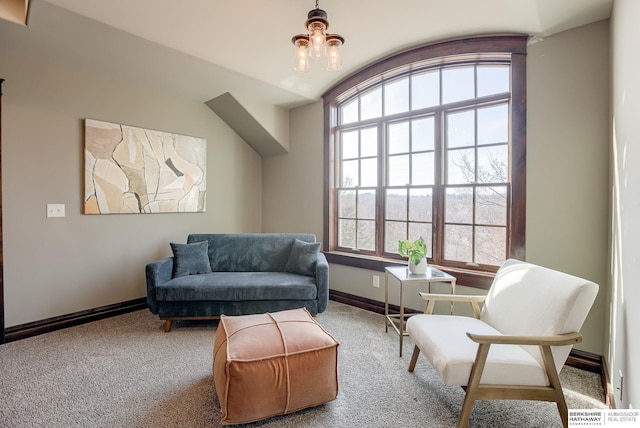 sitting room featuring baseboards and carpet floors