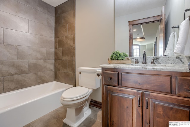 bathroom with toilet, vanity, and tile patterned flooring