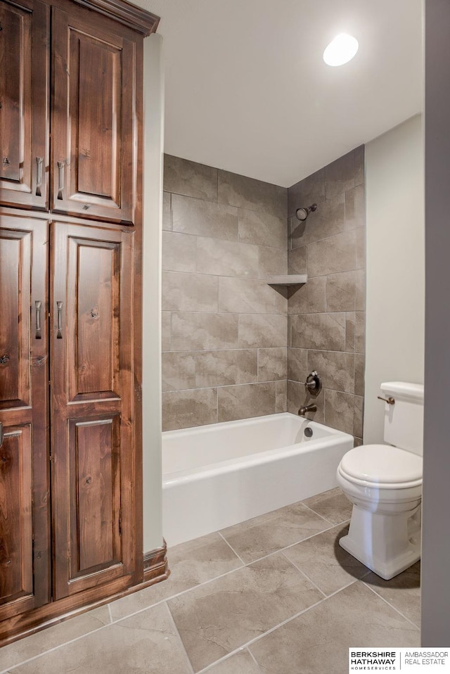 bathroom featuring toilet and shower / bathing tub combination