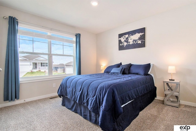 bedroom with carpet and baseboards