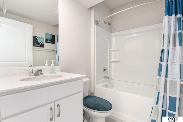 bathroom with toilet, shower / bath combo, and vanity
