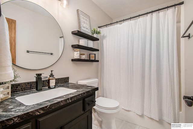 bathroom with backsplash, toilet, vanity, and tile patterned flooring