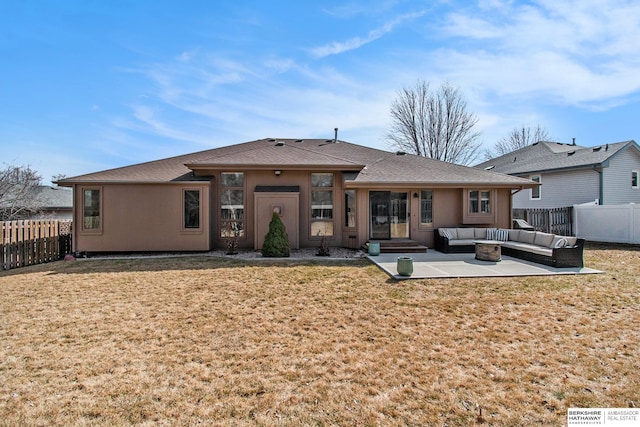 back of property featuring a patio area, a lawn, outdoor lounge area, and a fenced backyard