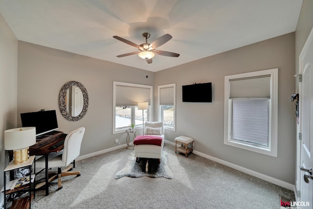 office featuring carpet flooring, a ceiling fan, and baseboards