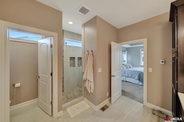 full bath with visible vents, a walk in shower, and baseboards