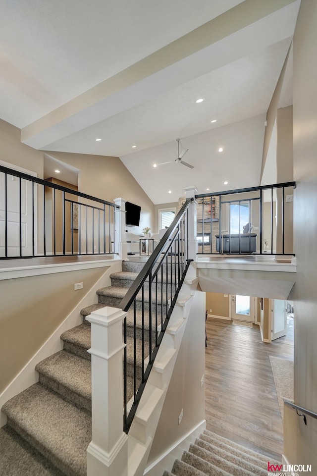 stairway featuring recessed lighting, wood finished floors, baseboards, and ceiling fan