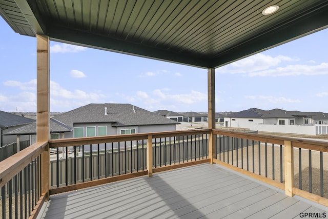 deck featuring a residential view and fence