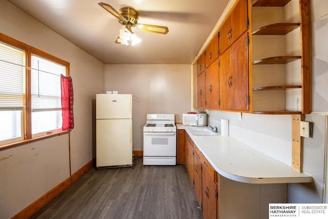 kitchen with open shelves, a sink, dark wood-style floors, white appliances, and light countertops