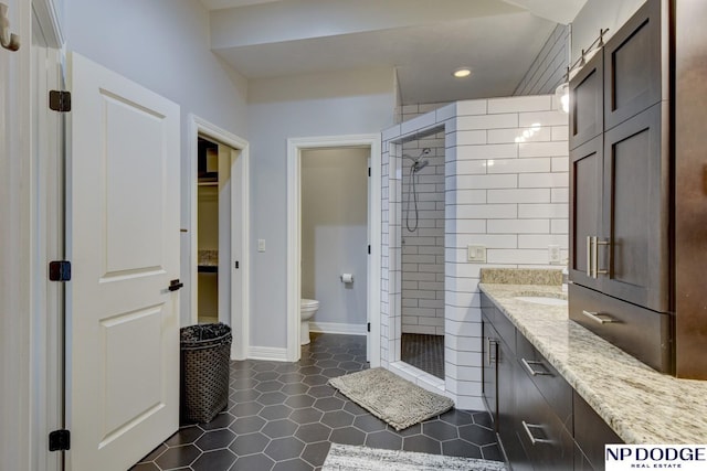 full bathroom with vanity, recessed lighting, a shower stall, tile patterned floors, and toilet