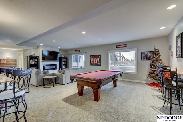 playroom with recessed lighting, baseboards, a glass covered fireplace, and carpet flooring