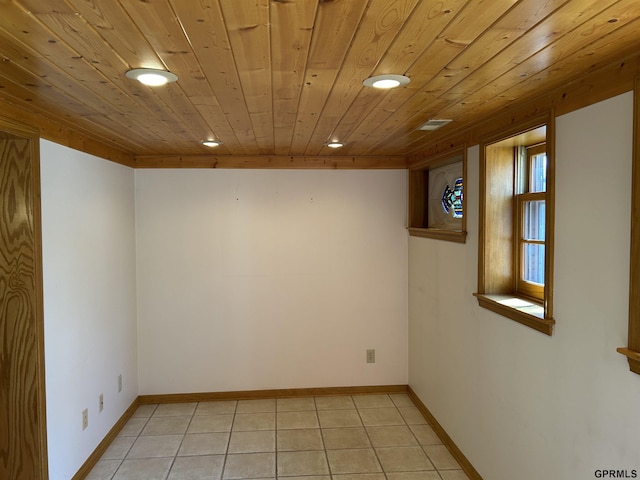 spare room featuring light tile patterned floors, recessed lighting, wooden ceiling, and baseboards