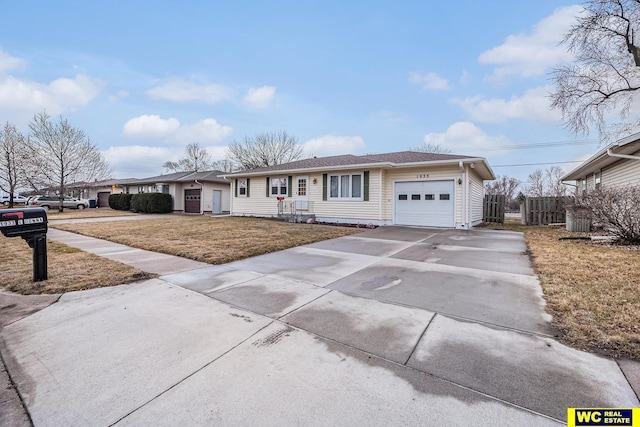 single story home with a garage, concrete driveway, a front lawn, and fence