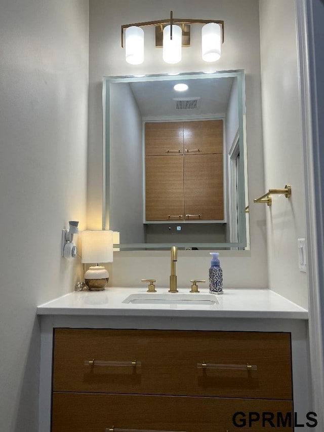 bathroom featuring visible vents and vanity