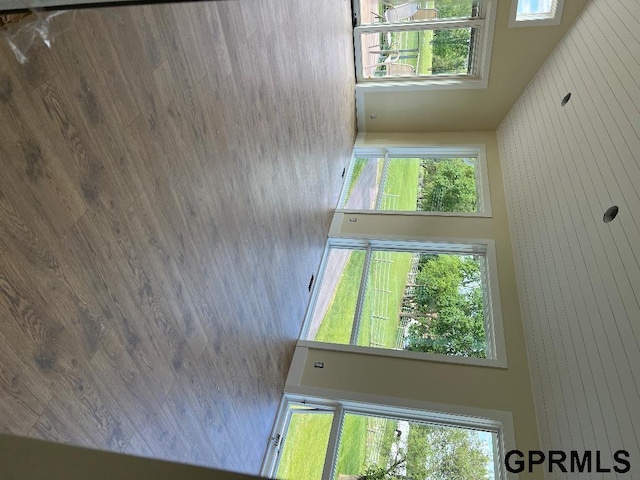 empty room featuring wood walls