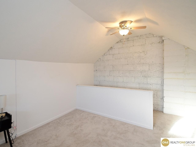 bonus room featuring light carpet, baseboards, lofted ceiling, and ceiling fan