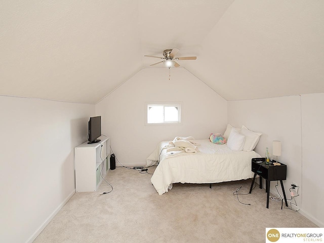 bedroom with ceiling fan, lofted ceiling, and light carpet