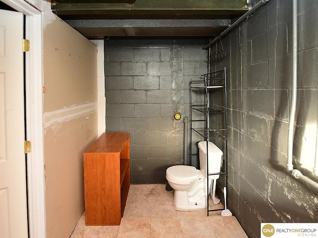 bathroom featuring toilet and walk in shower