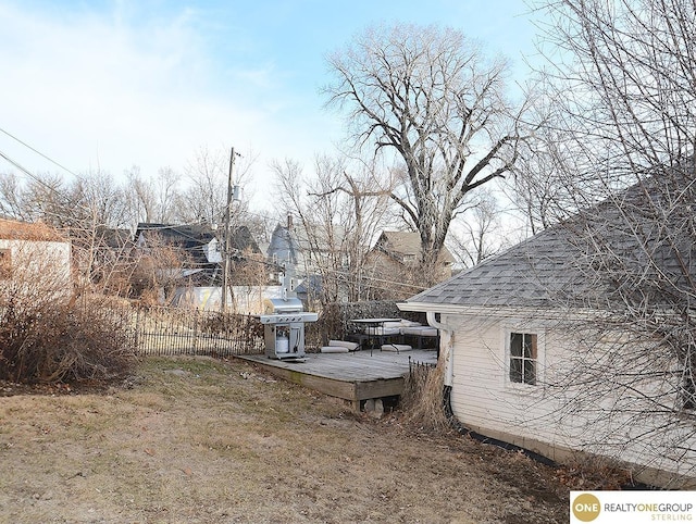 view of yard featuring a deck and fence