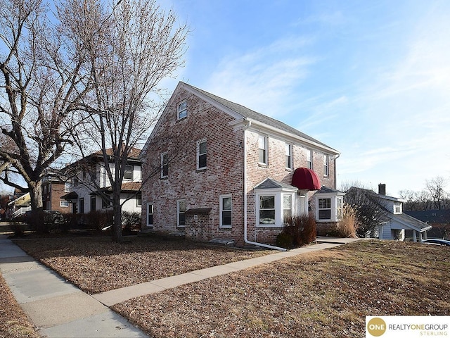 view of front of house featuring brick siding