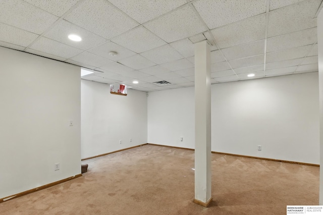 finished below grade area with carpet floors, baseboards, recessed lighting, and a paneled ceiling