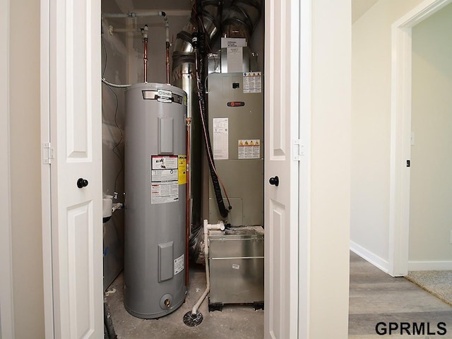 utility room with electric water heater