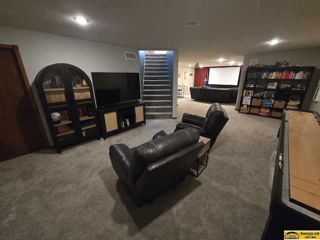 living area with stairs, visible vents, and carpet floors
