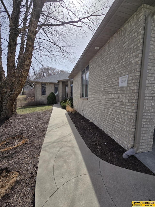 exterior space with brick siding