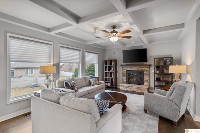 living area featuring ceiling fan, a fireplace, beam ceiling, baseboards, and coffered ceiling