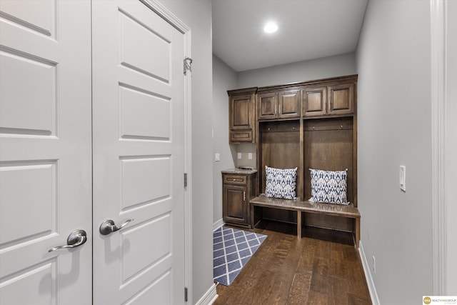 mudroom with baseboards and dark wood-style floors