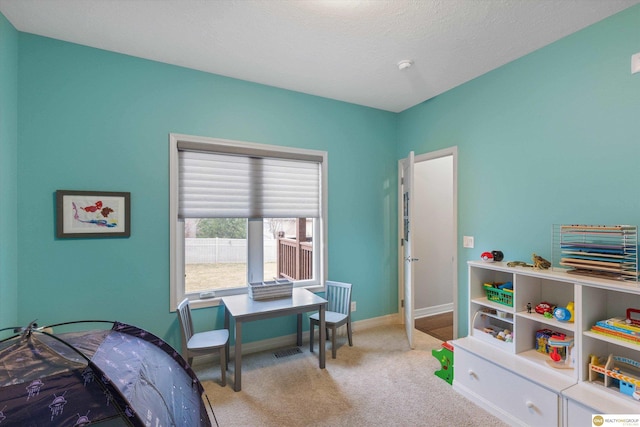 bedroom with light colored carpet, baseboards, and visible vents