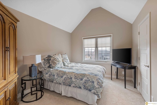 bedroom featuring baseboards, light colored carpet, and vaulted ceiling