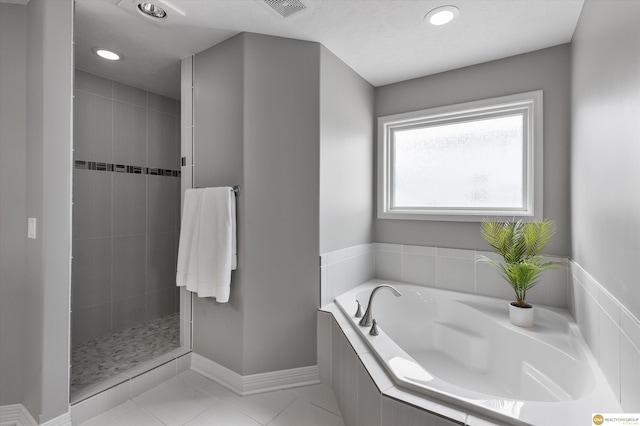 bathroom featuring a bath, visible vents, a shower stall, tile patterned floors, and recessed lighting