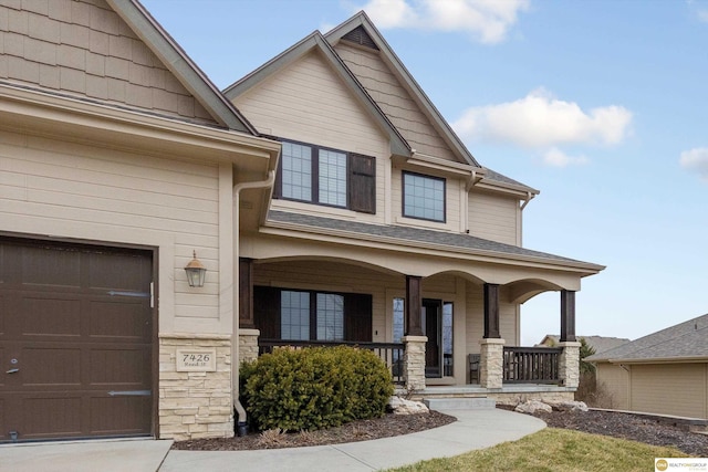 view of front of property with a porch and stone siding