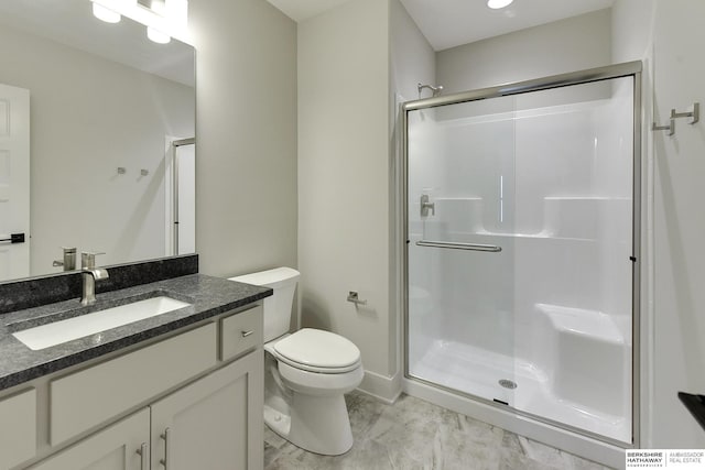 full bathroom with a stall shower, toilet, and vanity