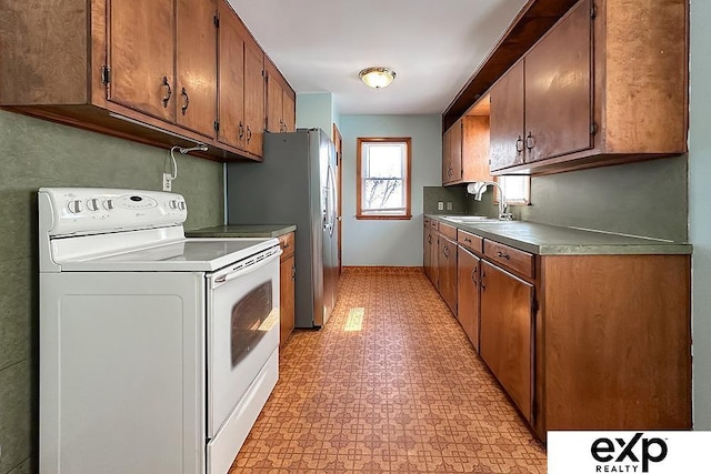 6027 S 36th St, Omaha, NE 68107 - kitchen featuring white electric stove, brown cabinets, light floors, and a sink