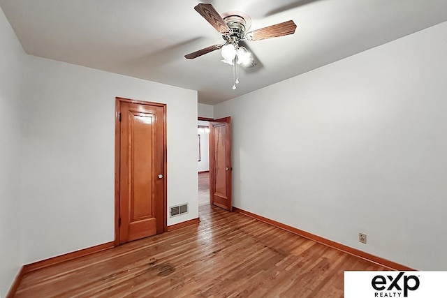 6027 S 36th St, Omaha, NE 68107 - empty room with light wood finished floors, visible vents, baseboards, and ceiling fan