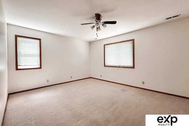 6027 S 36th St, Omaha, NE 68107 - empty room with visible vents, baseboards, light colored carpet, and ceiling fan