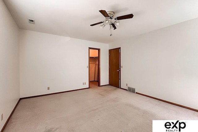 6027 S 36th St, Omaha, NE 68107 - empty room with light carpet, baseboards, visible vents, and ceiling fan