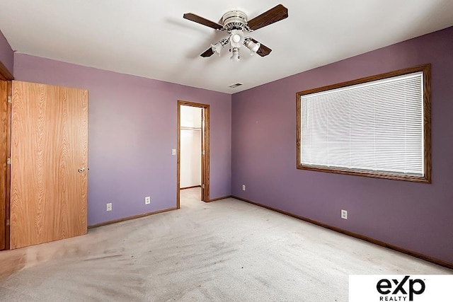 6027 S 36th St, Omaha, NE 68107 - unfurnished bedroom with visible vents, light colored carpet, baseboards, and ceiling fan