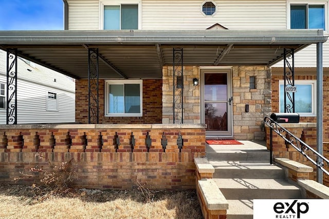 6027 S 36th St, Omaha, NE 68107 - view of front facade with stone siding and a porch