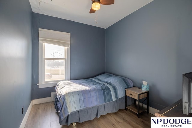 1042 Seward St, Seward, NE 68434 - bedroom with visible vents, wood finished floors, baseboards, and ceiling fan