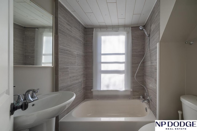 1042 Seward St, Seward, NE 68434 - bathroom featuring toilet, shower / tub combination, and a sink