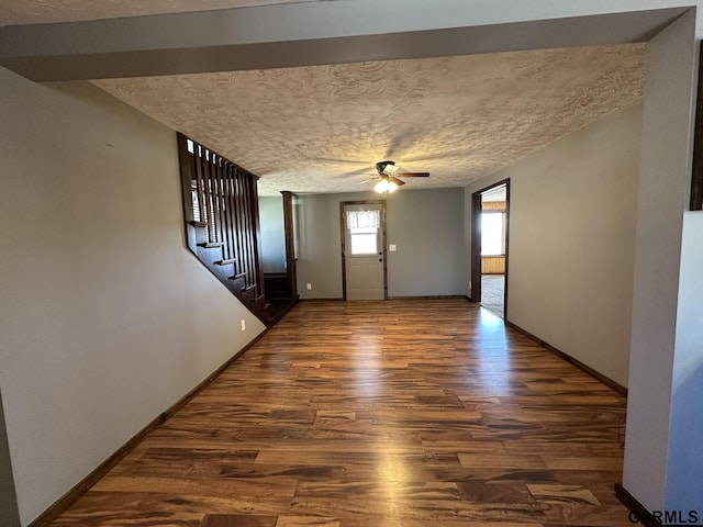108 S Quince Ave, Dewitt, NE 68341 - entryway featuring stairway, baseboards, wood finished floors, and a ceiling fan