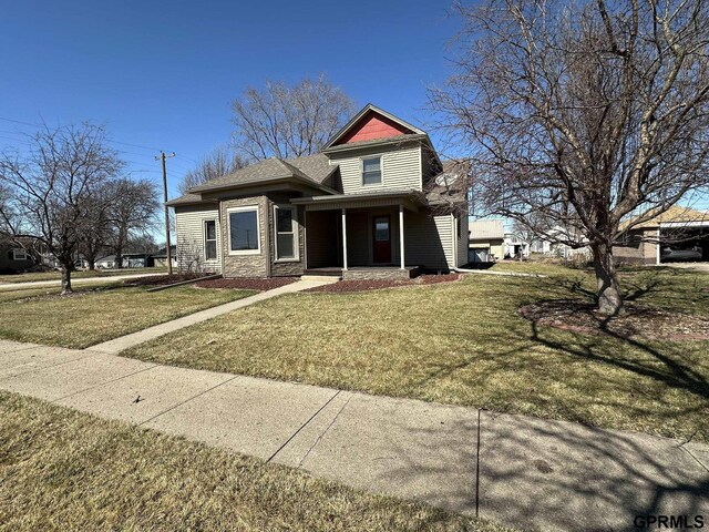 108 S Quince Ave, Dewitt, NE 68341 - view of front of home featuring a front lawn and stone siding