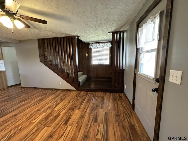 108 S Quince Ave, Dewitt, NE 68341 - entrance foyer with ceiling fan, a textured ceiling, wood finished floors, and stairs