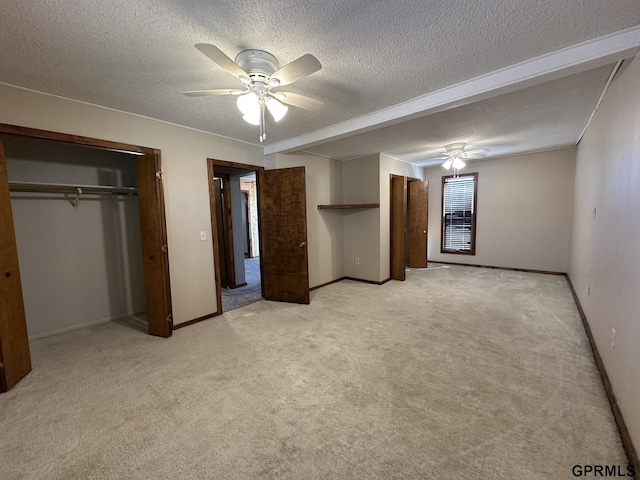 108 S Quince Ave, Dewitt, NE 68341 - unfurnished bedroom featuring light colored carpet, a textured ceiling, baseboards, and ceiling fan