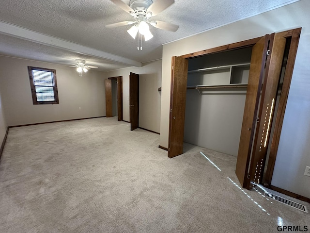 108 S Quince Ave, Dewitt, NE 68341 - unfurnished bedroom with carpet, a ceiling fan, and a textured ceiling
